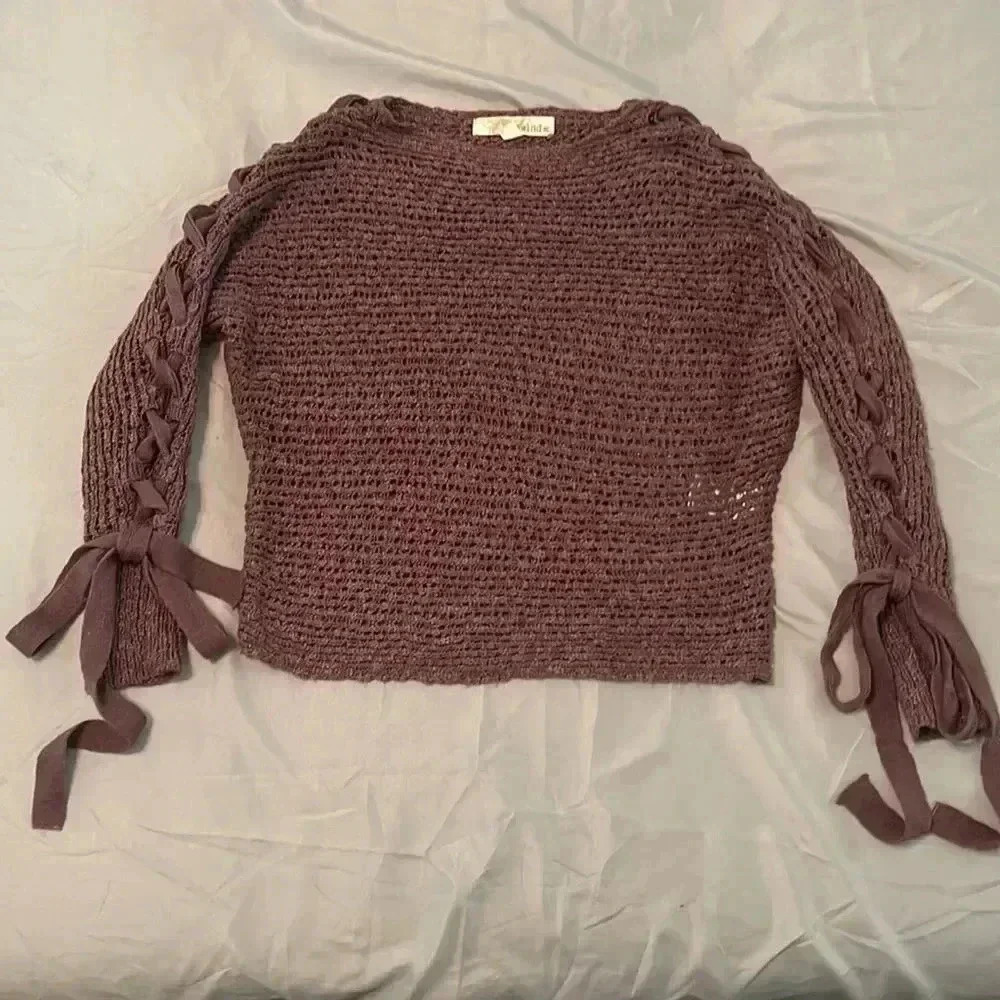 Crop top sweater with braids down the arms